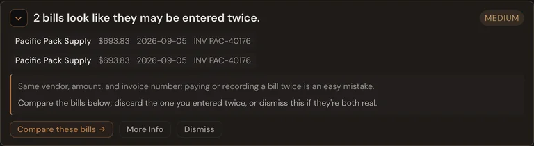 A books-health card: two bills that look like they were entered twice, with a button to compare them.